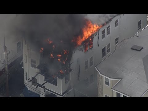 Multi-alarm fire rips through Lawrence triple-decker