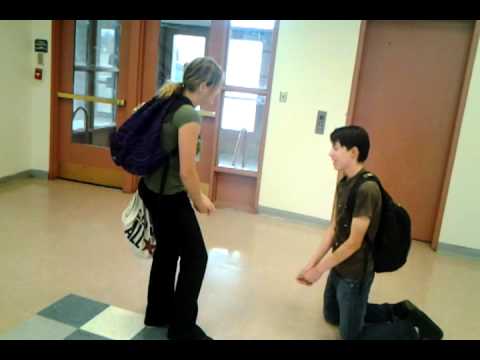 on his knees :D begging