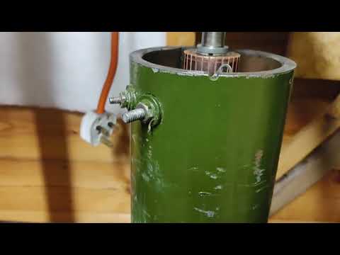 pressing Lucas dynamo bearing into end plate.