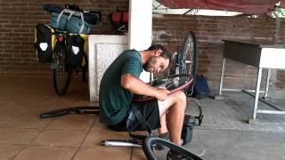 preview picture of video 'Bicycle problems, Trevor filing his wheel - Cycling Around the World'