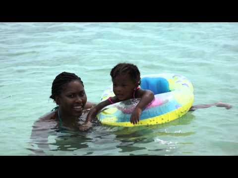 Liana and Velma in the water at the beach