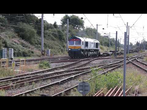 66747 NWT liveried  passing Carnforth with 4S57 Hams Hall - Mossend 31st August 2022.