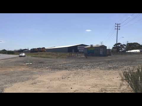 Light engines XR550 XR552 and XR555 at Thompsons Road backing up to a grain train 6/3/2021
