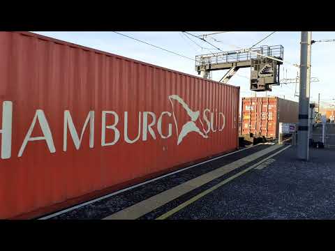 DB Cargo 66017 on a Intermodal passing through Peterborough on 12/1/22