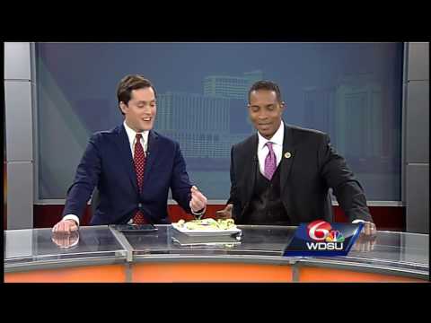 WDSU's Aubry Killion and Meteorologist Damon Singleton give cricket king cake a taste