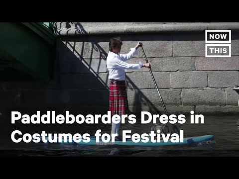 Paddleboarders Dress in Costume for Annual Festival | NowThis