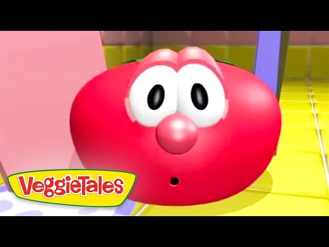 Red round cartoon character with big white eyes and surprised expression, VeggieTales logo in the bottom-left corner.
