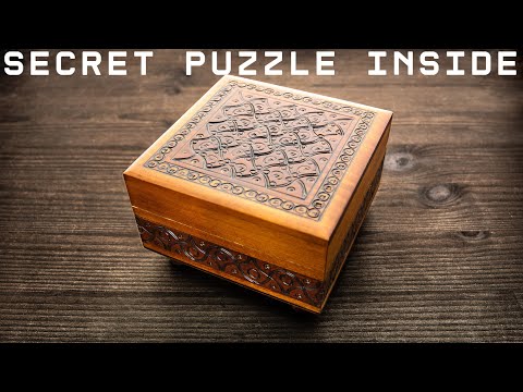 New Hanayama puzzle inside the wooden puzzle box.