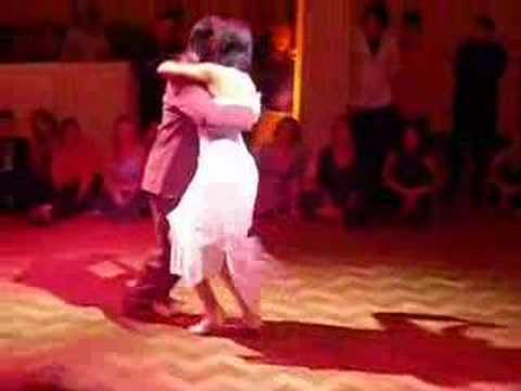  Fabian Peralta  and  Natacha Poberaj  are  dancing  to  the  tango  "  Poema  "