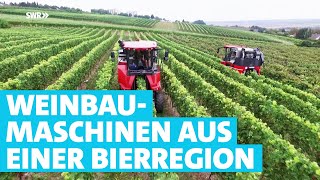 Rote Riesen im Weinberg: Die Traubenvollerntemaschinen aus dem Hunsrüc
