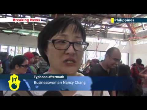 Typhoon Haiyan Aftermath: Queues at Tacloban Airport as survivors seek to escape devastation
