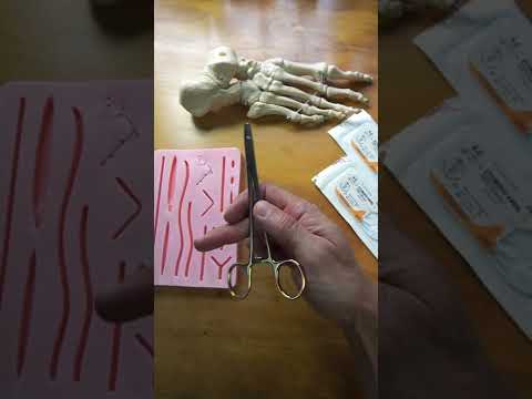 How to hold a needle holder