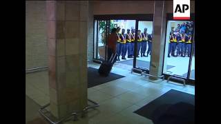 French team arrive at airport for journey home