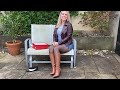 Reviewing Brown Knee High Leather Stiletto Boots Matched With Black Wolford Tights And Denim Skirt