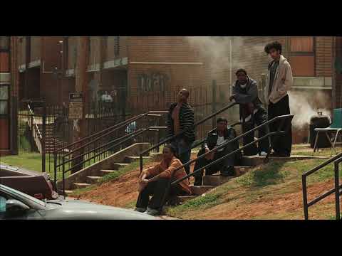 The Blind Side trailer frame: Michael Oher walking with the Tuohy family