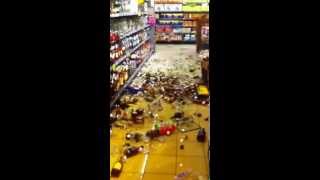 Man smashing bottles at store