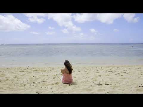 Girl Sitting on Beach