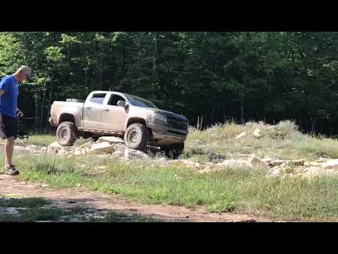 LIFTED ZR2 on 35s messing around in a rock pit