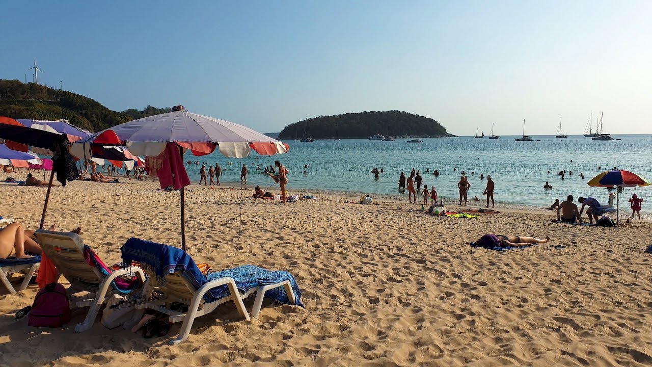 Embark on an invigorating walking tour around Nai Harn Beach.