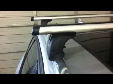 Audi A4 Avant with Flush Side Rails Outfitted with a Thule 460R Rapid Podium Foot Pack