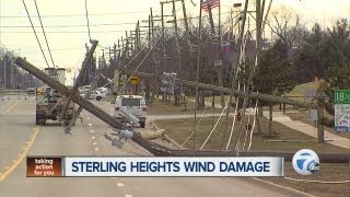 High winds knock down power poles