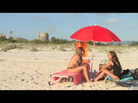 Lovers of Tuscany's 'paradise' beach have factory to thank | AFP