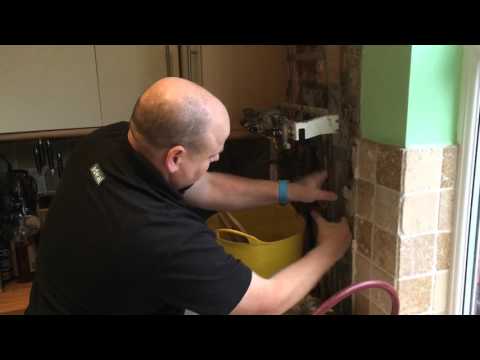 Cutting into a live water pipe and fitting new stop tap