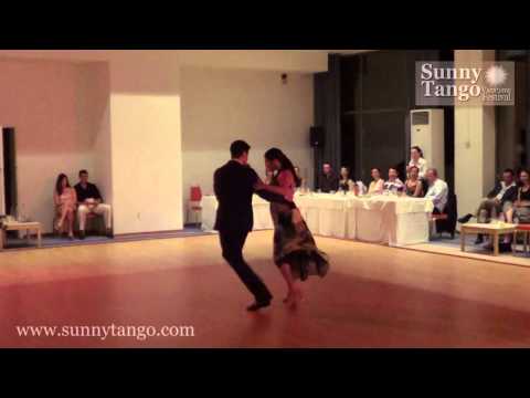  Sebastian Jimenez  and  Maria Ines Bogado  are  dancing  to  the  vals  "  Ilusion Azul  "  by  Alfredo De Angelis  at  Sunny Tango Festival  in  2013