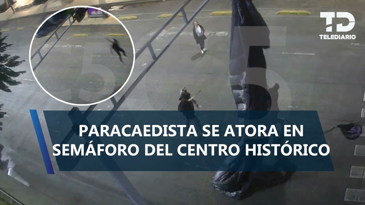 Paracaidista aterriza sobre avenida Balderas, CdMx; queda atorado en semáforo