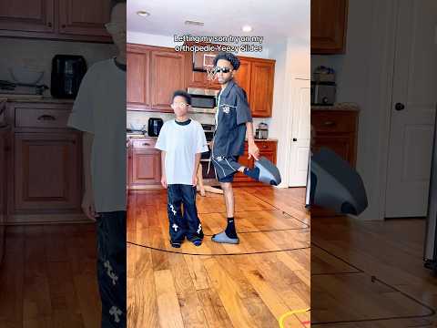 Letting my son try on my orthopedic Yeezy Slides