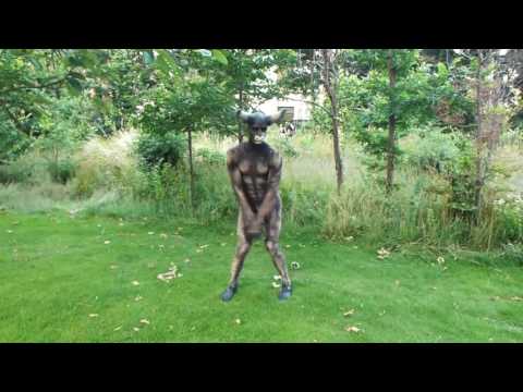 Humanimals - Various Walkabout Animals - Minotaur Gets Some Sun Warmth Outside His Labyrinth