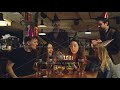 Young Pretty Brunette Is Making Wish And Blowing Out Candles On Birthday Cake While Celebrating