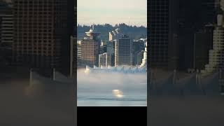 Fog flows through Canada Place cruise terminal in Vancouver Feb 5