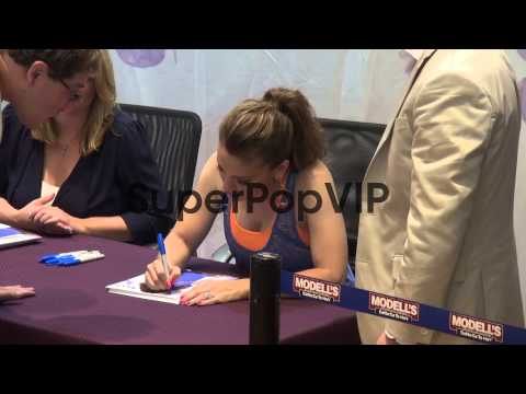 Alyssa Milano meets her fans at the Modell's Sporting Goo...