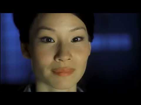 Kill Bill Vol. 1 trailer frame with The Bride in yellow tracksuit unsheathing the katana