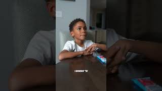 BOY CHECKS TO SEE HOW SMART HIS DAD IS...