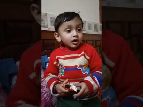 cute baby Aakarsh unwrapping and saying chocolate