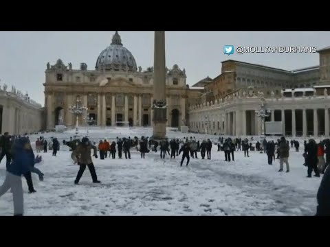 Snowball fight in St Peter's square as snow storm hits Vatican and Rome