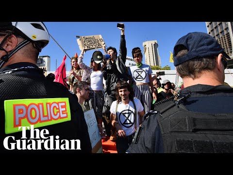 Extinction Rebellion protesters block Brisbane street: 'Tear the system to the ground'