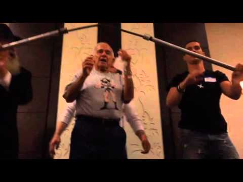 Mike Greenstein bending steel on his nose at 93 years old