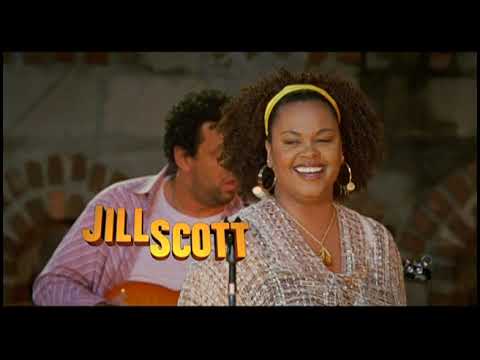 Trailer frame showing the street crowd and stage rig at the Brooklyn block party