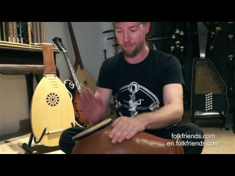 Rob from OMNIA playing Udu drum @ Folkfriends music store