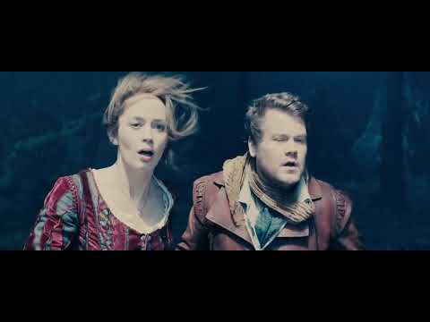 Into the Woods (2014) official trailer frame of the forest path and castle skyline, setting the musical’s fairytale-meets-reality tone