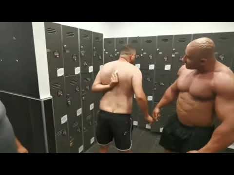 BODY BUILDER CAN'T REACH STICKER ON HIS BACK