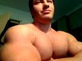 hot bodybuilder flexing his huge muscles