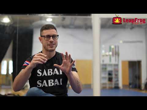 Head Muay Thai coach Aaron Ramos from Saibadee Muay Thai Academy speaking with Ahmer Khan