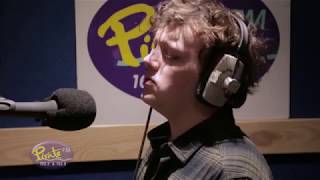 X-Factor's Benji Matthews performs in the Pirate FM Studios