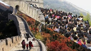 Tourists crowd scenic spots during China’s national holidays