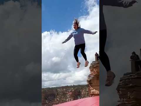 Cliff airbag is wild! 😱🔥 Guy jumps, girl flies! #ScaryRide #TravelWonder