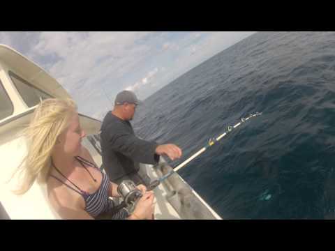 Lauren Catching a Trigger Fish in the Ocean